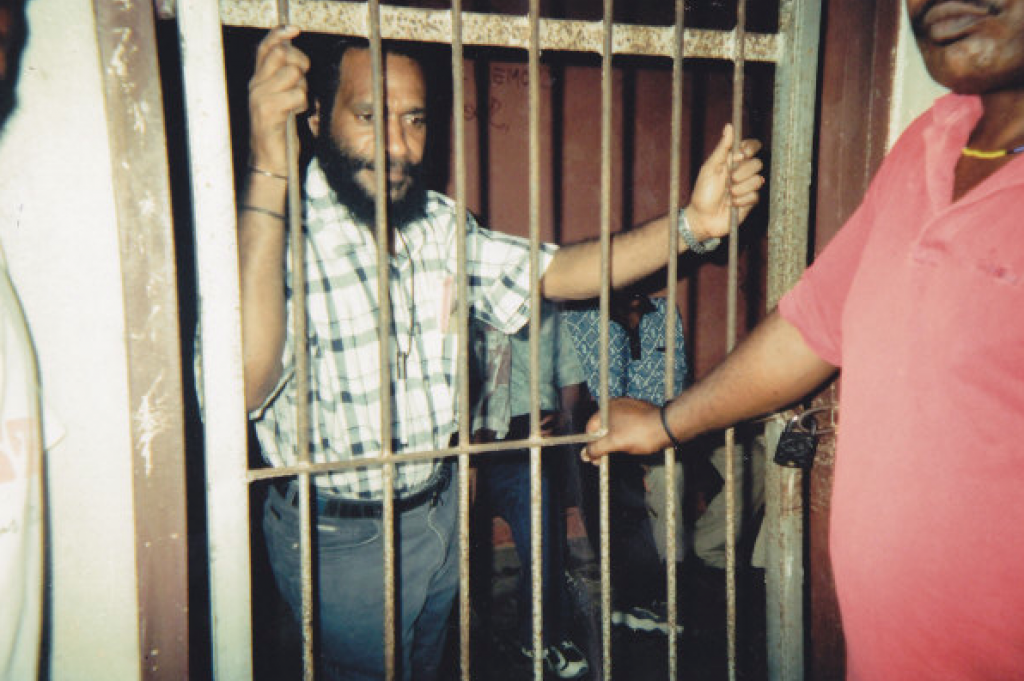 Benny in prison during his trial