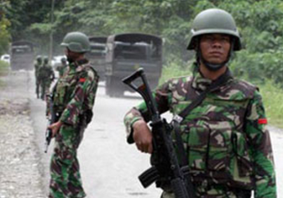 Indonesian military on patrol near the mine