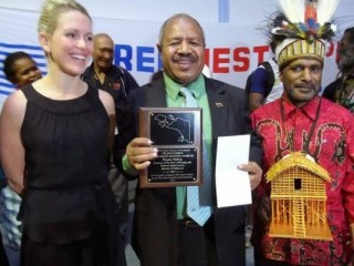 Powes Parkop (centre) receives his award alongside Benny Wenda and Jennifer Robinson