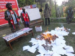 West Papuans peacefully burn their own Indonesian voting papers on 9th July