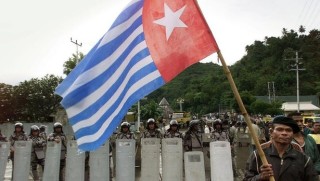 flag in front riot police