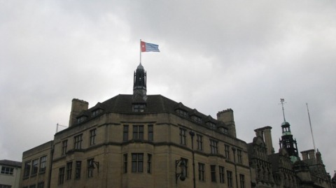The Morning Star flag flies above Oxford Town Hall.