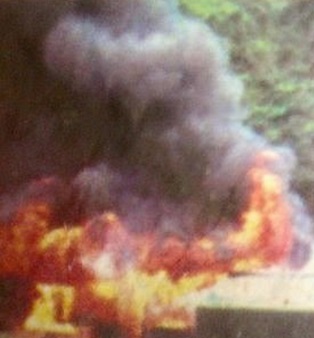 A house being burned in Utikini village by the Indonesian military/police 