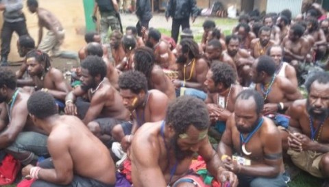 West Papuans stripped and interrogated by Indonesian police in Utikini village 