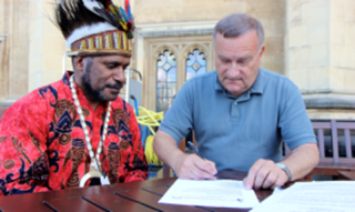 UK MP Nick Brown signing the International Parliamentarians for West Papua declaration in the presence of West Papuan Independence Leader Benny Wenda