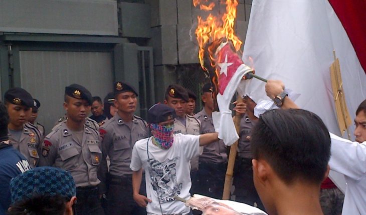 Indonesians burning the West Papuan flag