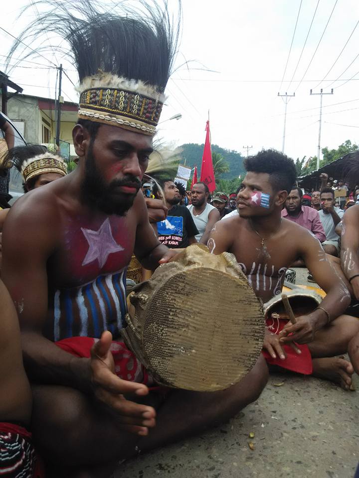 A powerful show of resistance and defiance of Indonesian oppression, a West Papuan student in traditional dress rallies her people in a freedom salute at a peaceful demonstration in December 2015. 