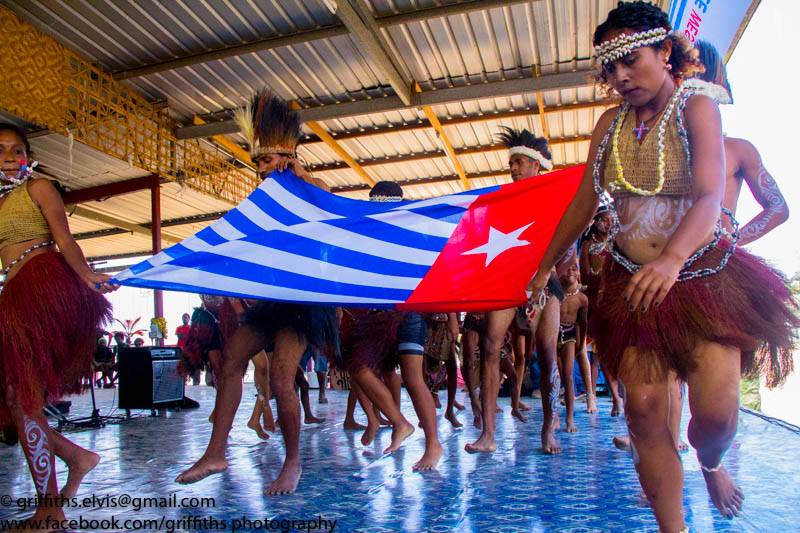 West Papuan youths dancing in their traditional bilas (traditional dress) at a West Papuan Cultural Day in Port Moresby, Papua New Guinea