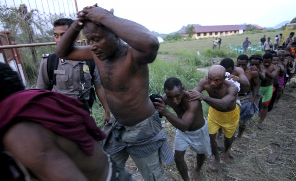 Lined up like slaves and stripped of their clothes. culture and dignity. West Papuan people are herded away to be tortured by the Indonesian police after attending a peaceful pro-Independence Congress in 2011 